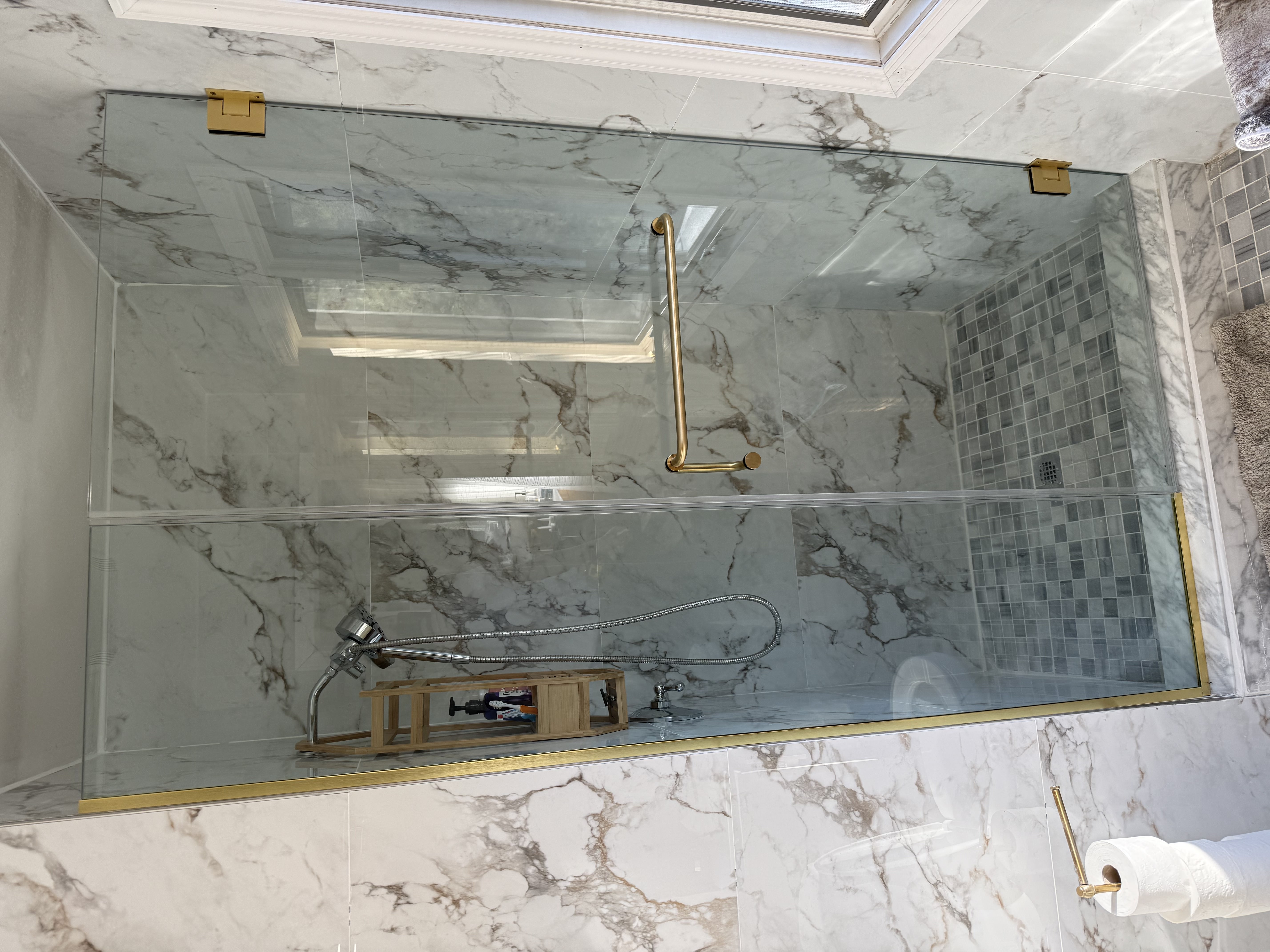 Shower glass with brass hardware