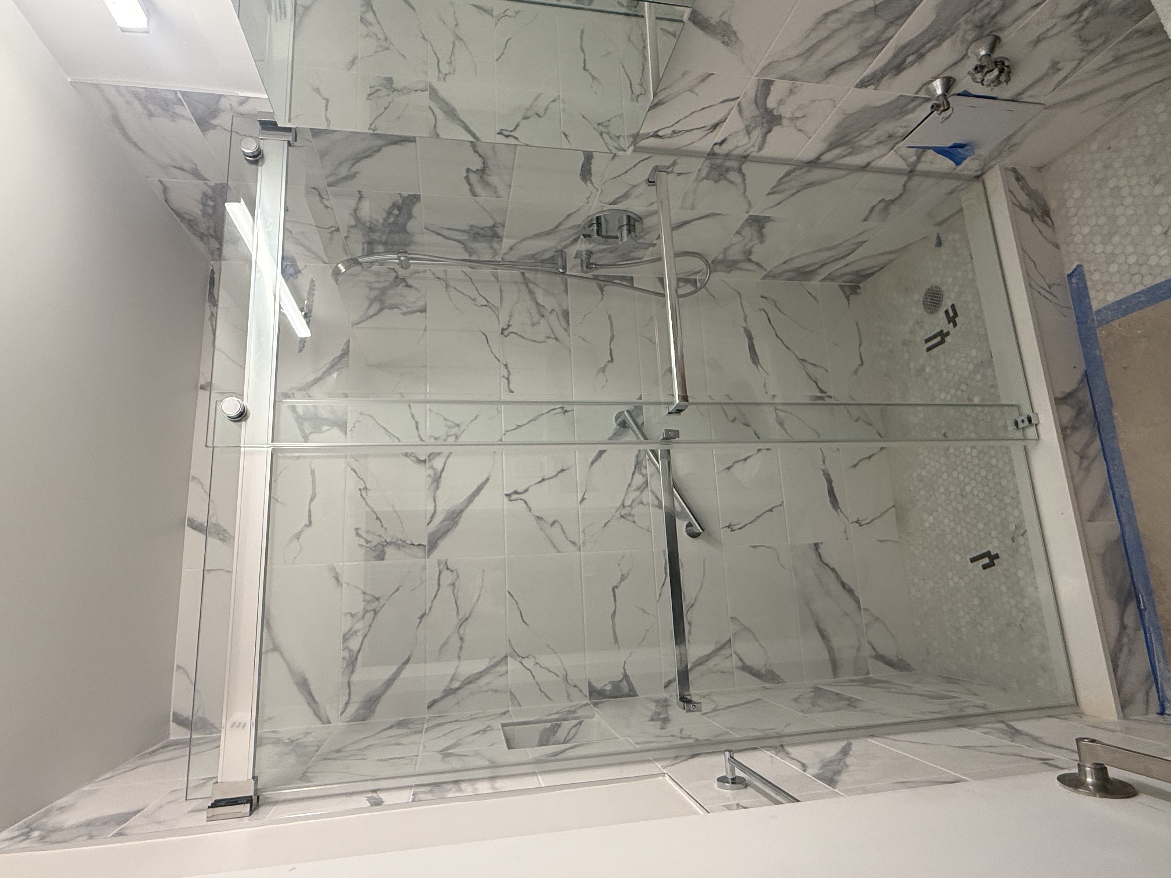 Interior glass railing with black handrail