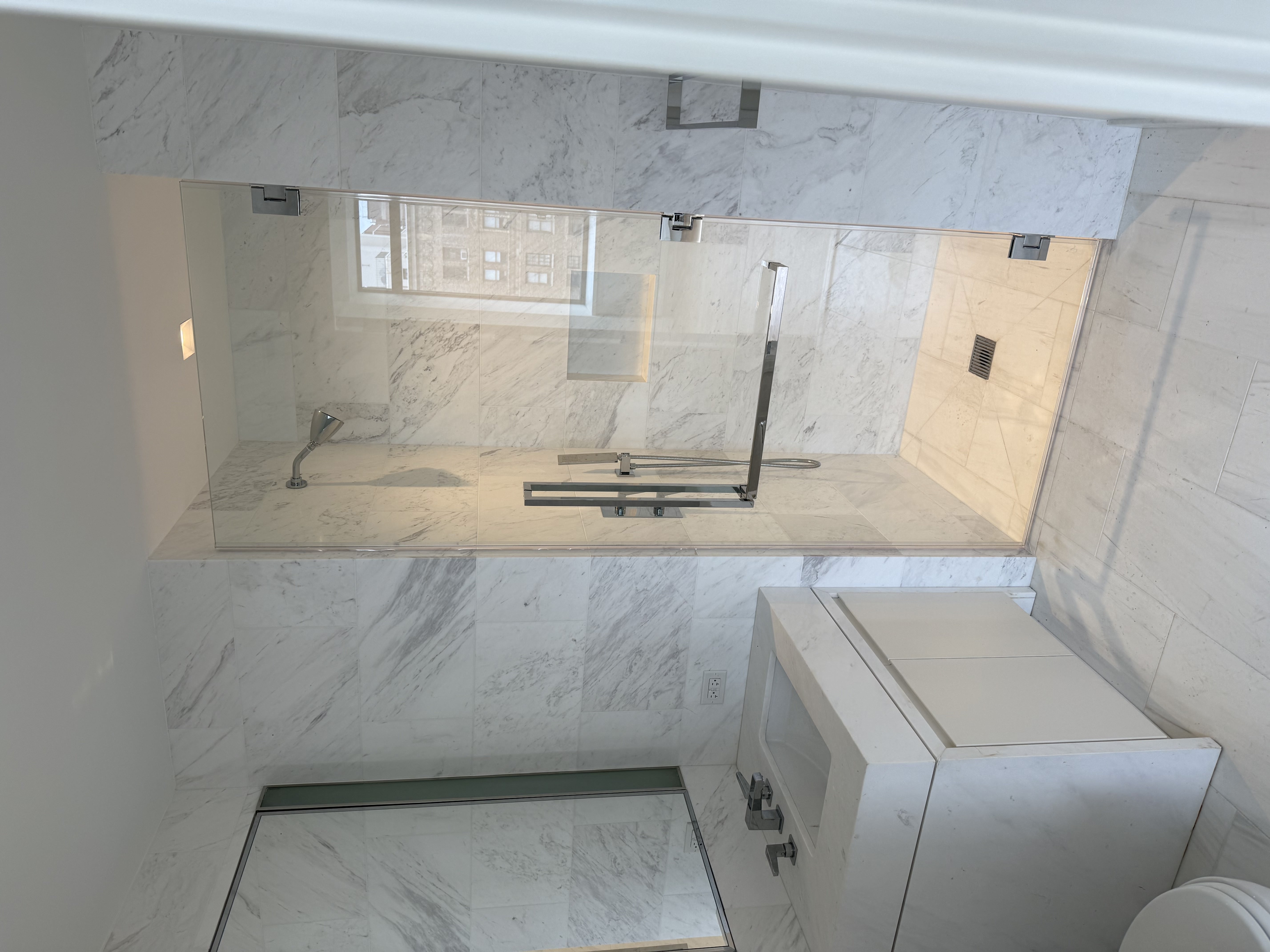 Storefront glass and black metal entry system